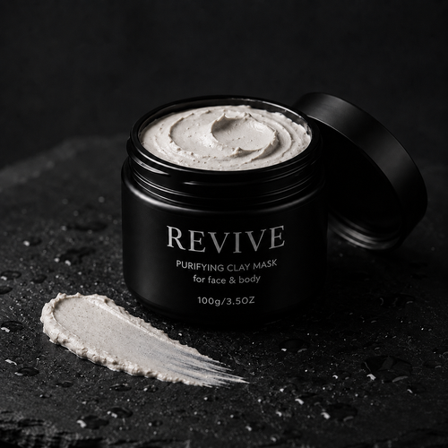 Open REVIVE Purifying Clay Mask jar showing swirled grey clay, with a smooth clay swatch beside it on wet dark stone